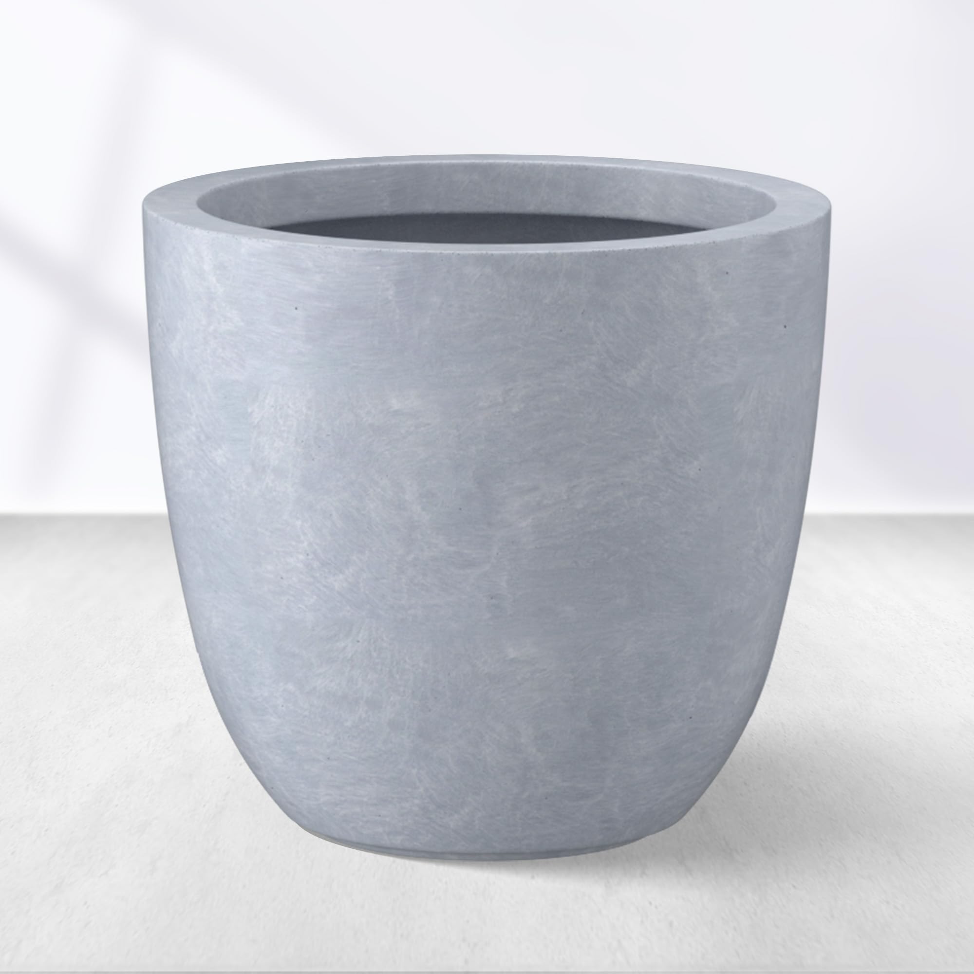 Kante front view of blue-gray planter showing modern silhouette and curb appeal