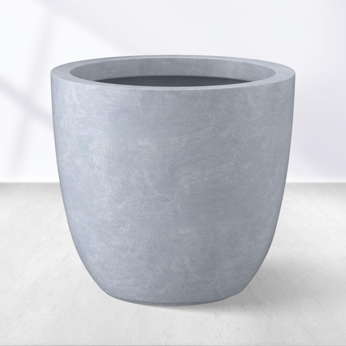 Kante front view of blue-gray planter showing modern silhouette and curb appeal