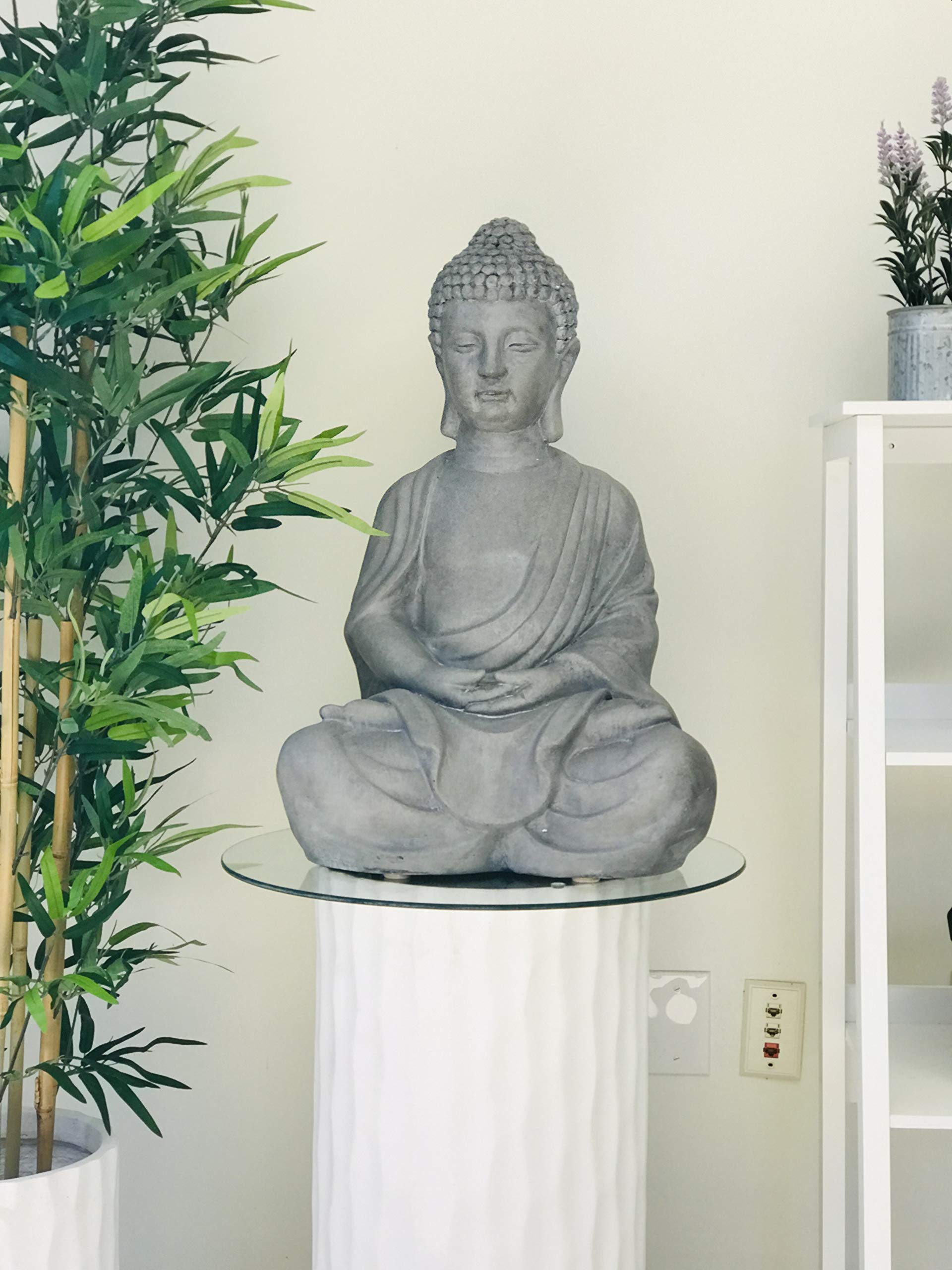 Kante Buddha staged in garden with plants demonstrating tranquil focal point benefit