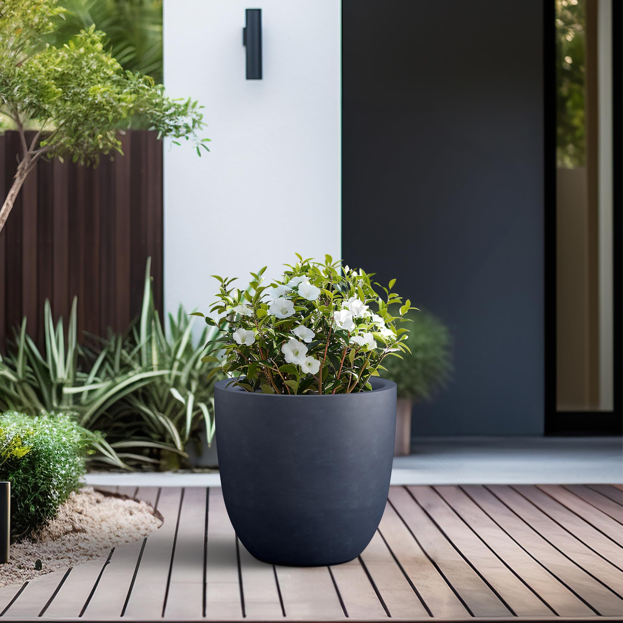 Kante planter beside a chair to show scale and practical outdoor fit