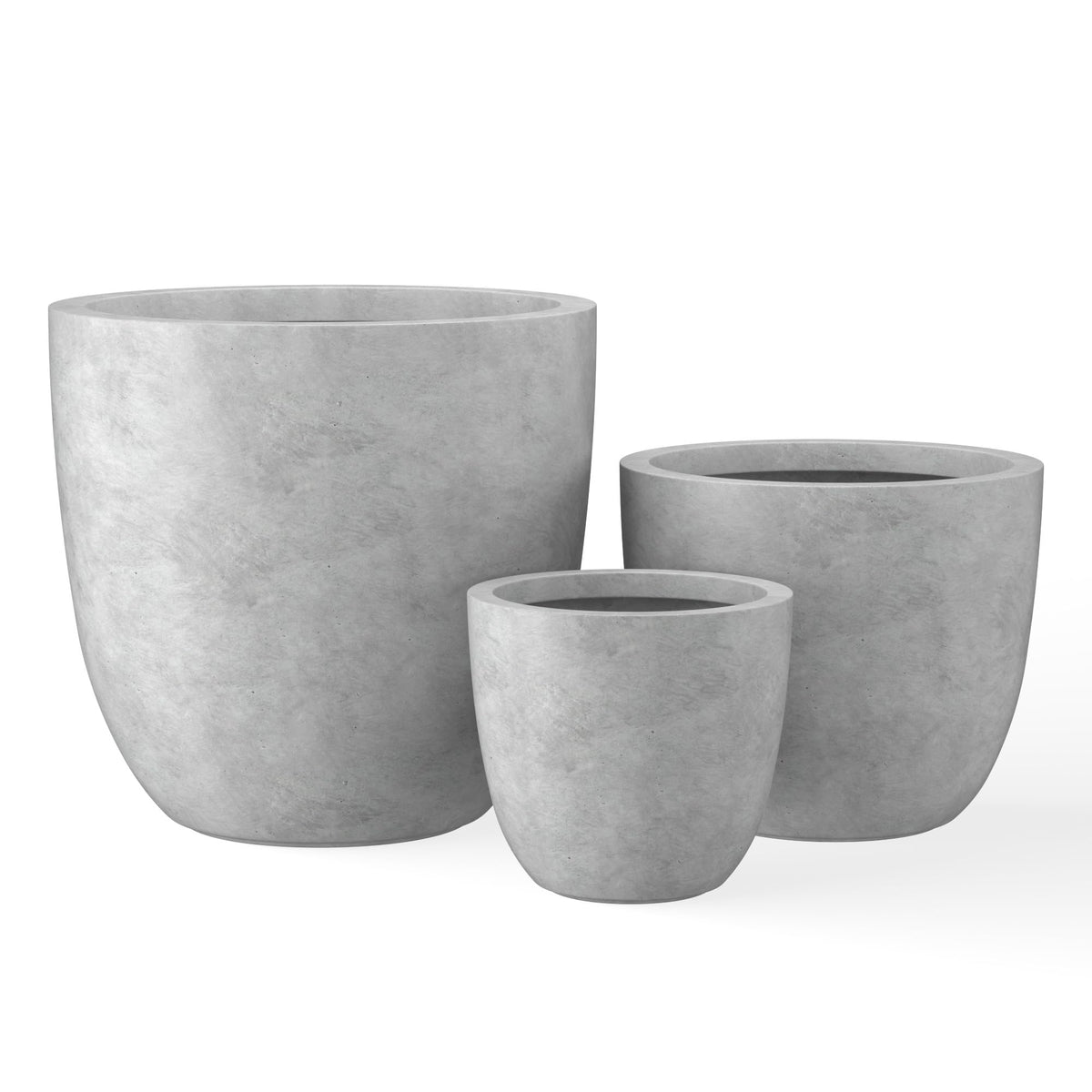 Kante front view of three pale gray bowl planters showing modern grouping and curb appeal