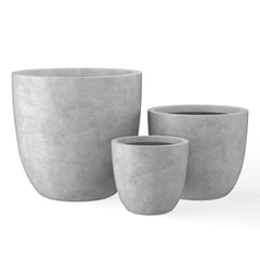 Kante front view of three pale gray bowl planters showing modern grouping and curb appeal