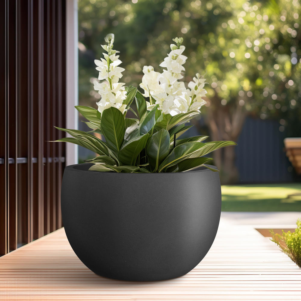 Kante in use on patio styled with plants showing weather resistance and decorative impact benefit
