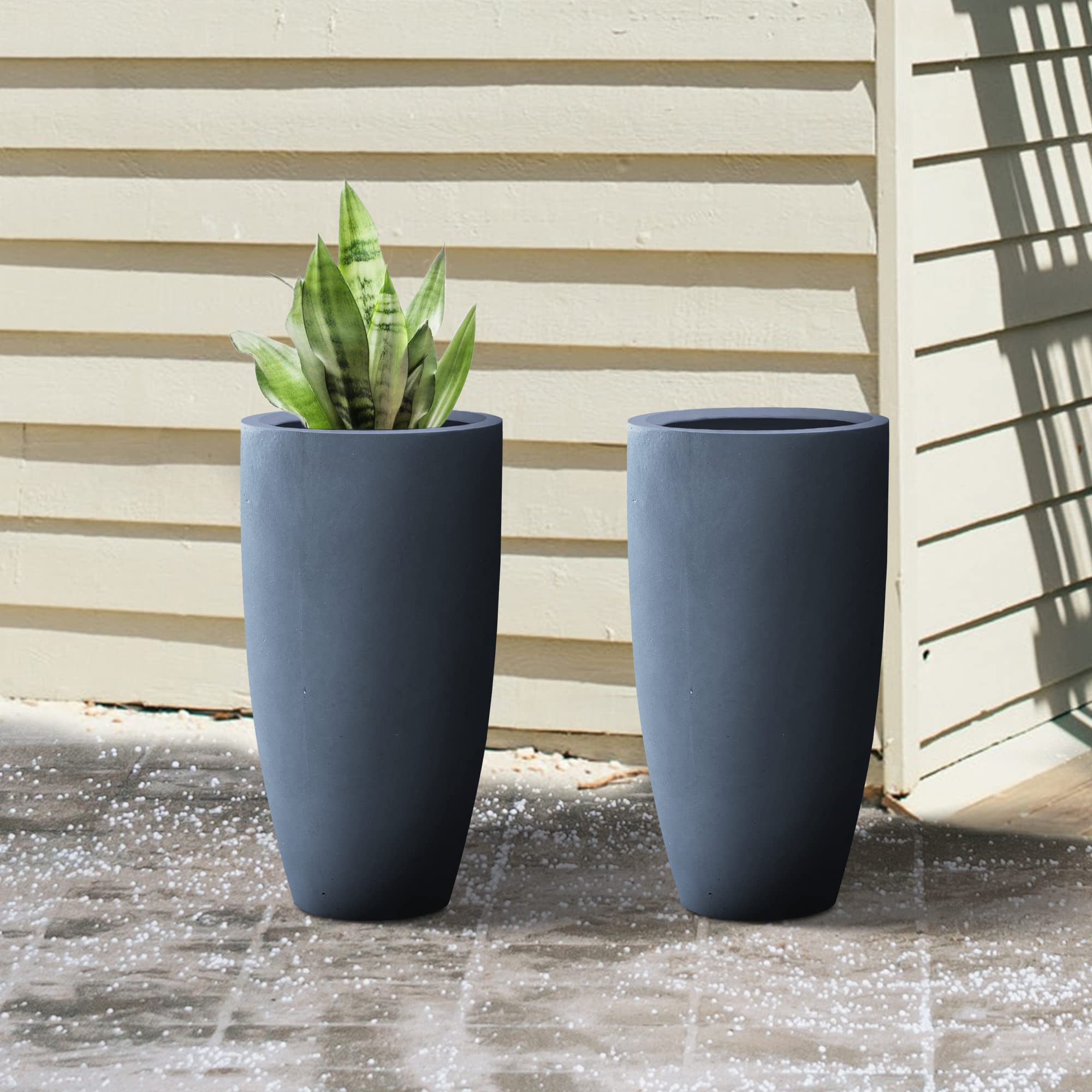 Kante on a patio with plants demonstrating outdoor styling and durability