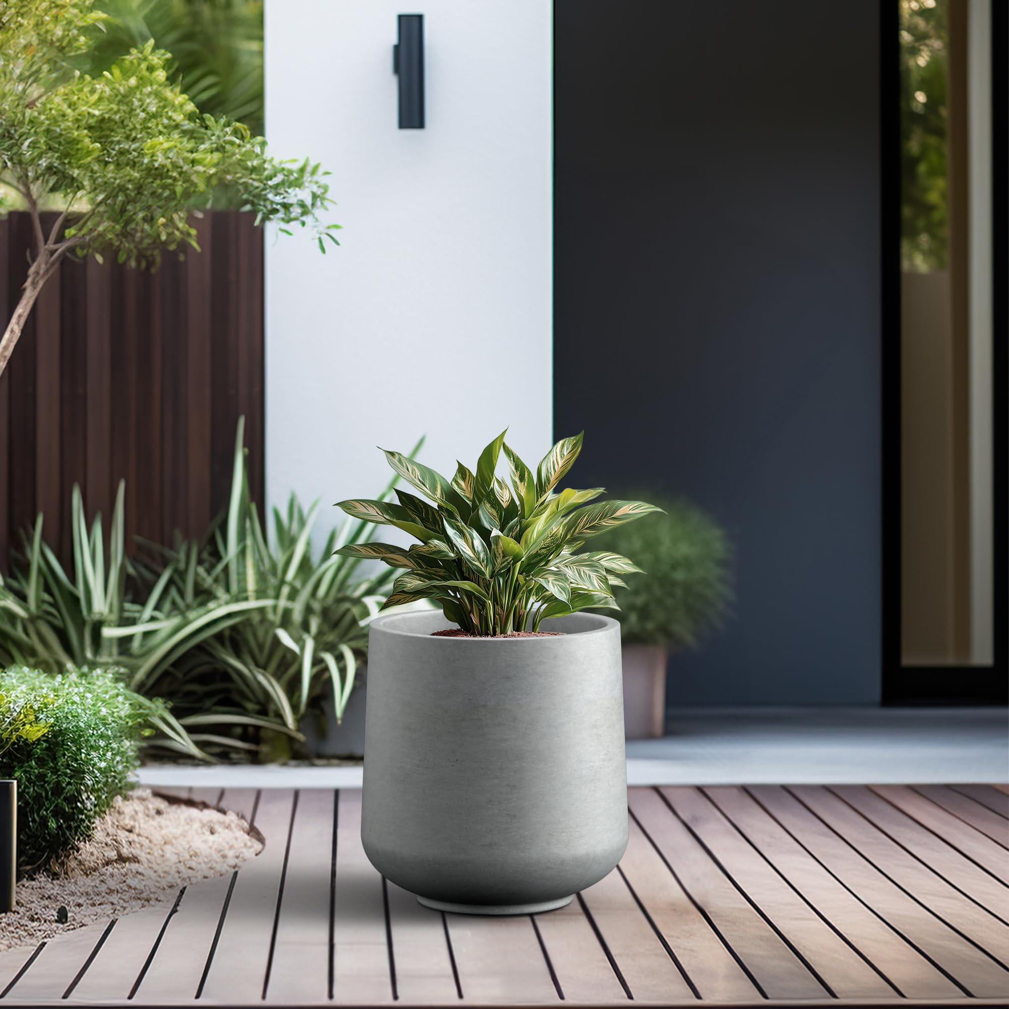 Kante planter on porch with plants, demonstrates durable outdoor styling and charm