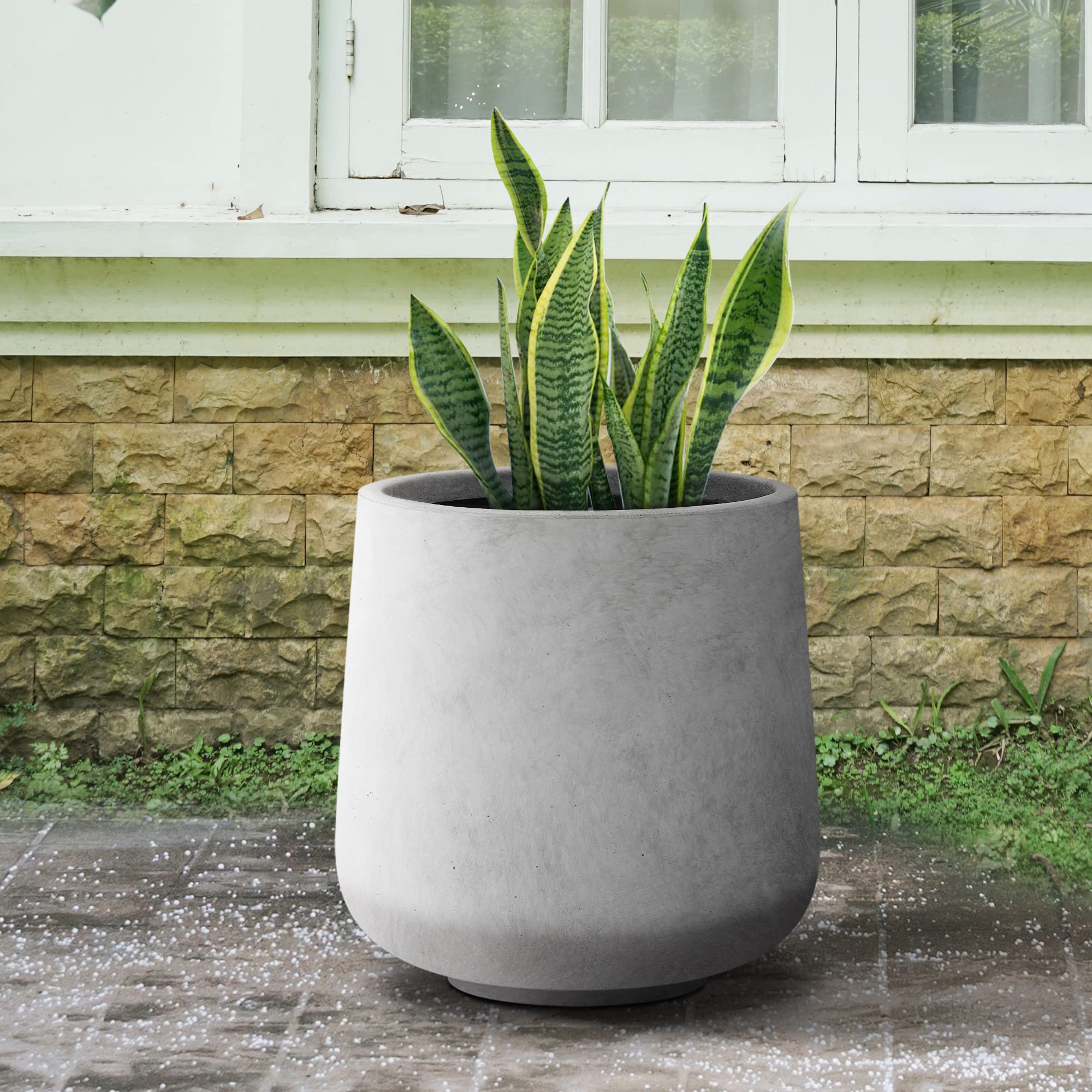 Kante planter drain plug detail demonstrating indoor-outdoor water control