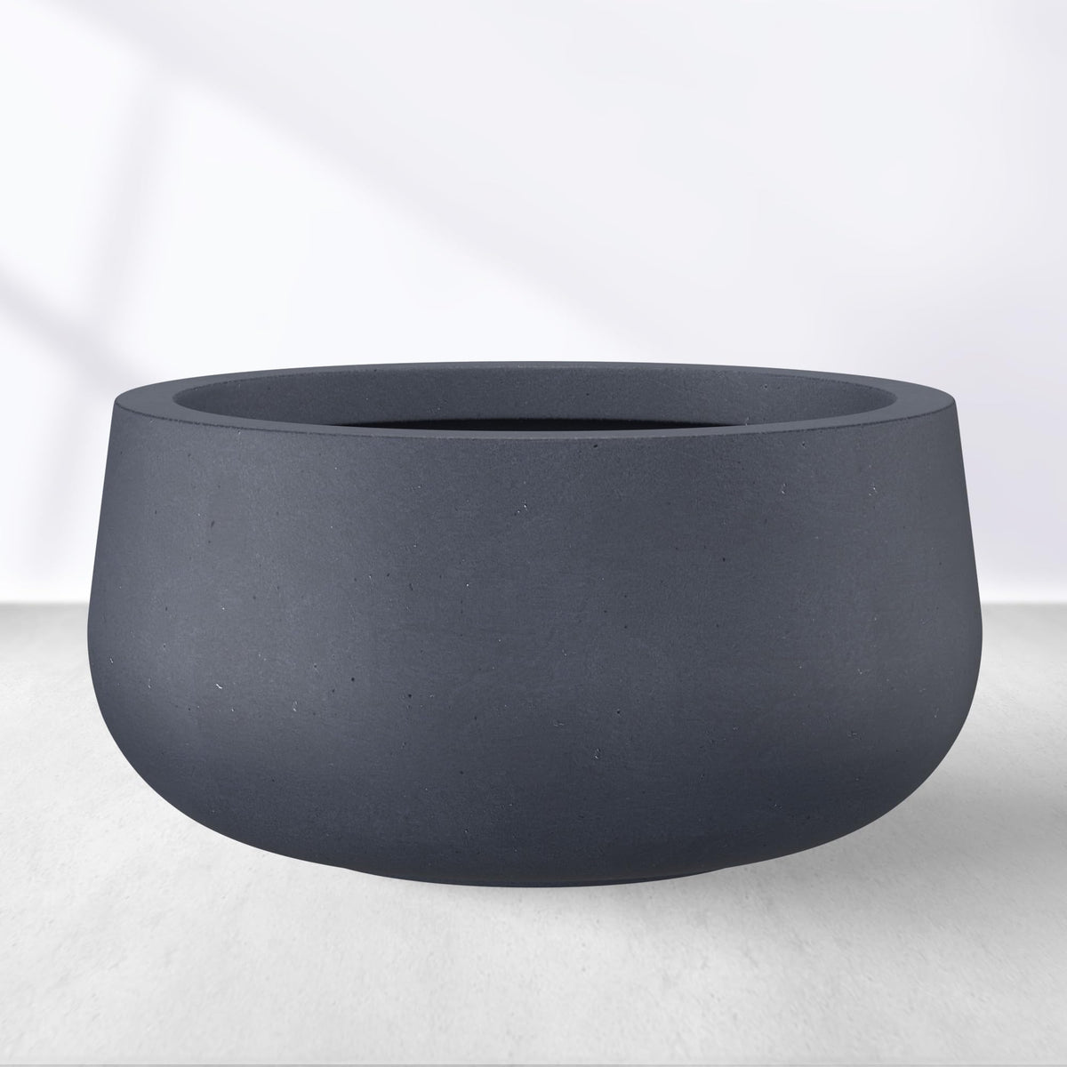 Kante planter front view showing sleek charcoal finish and modern shape for curb appeal