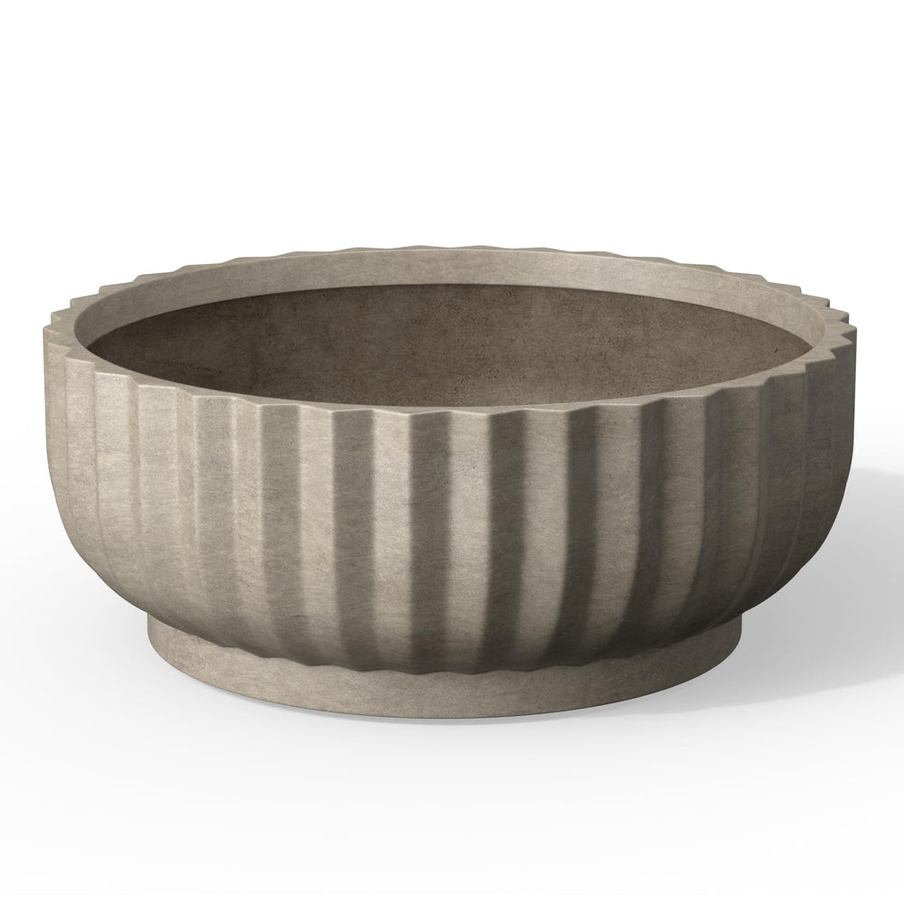 Kante front view of weathered concrete planter showing modern round shape and benefit of clean curb appeal