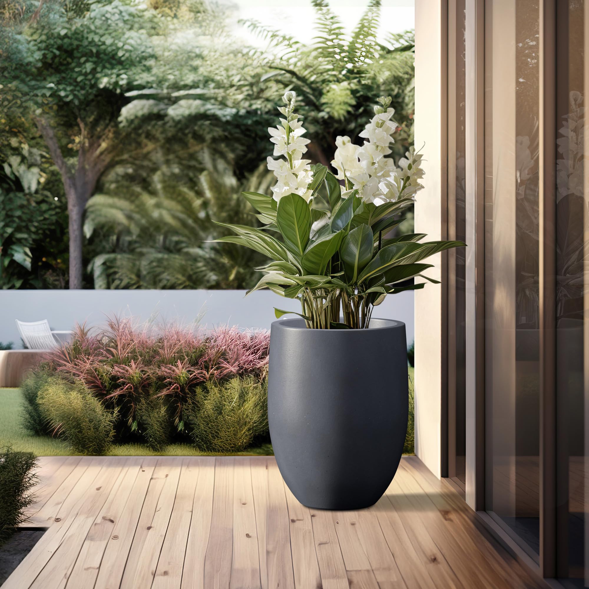 kante planter in use on patio with large plant adding architectural greenery