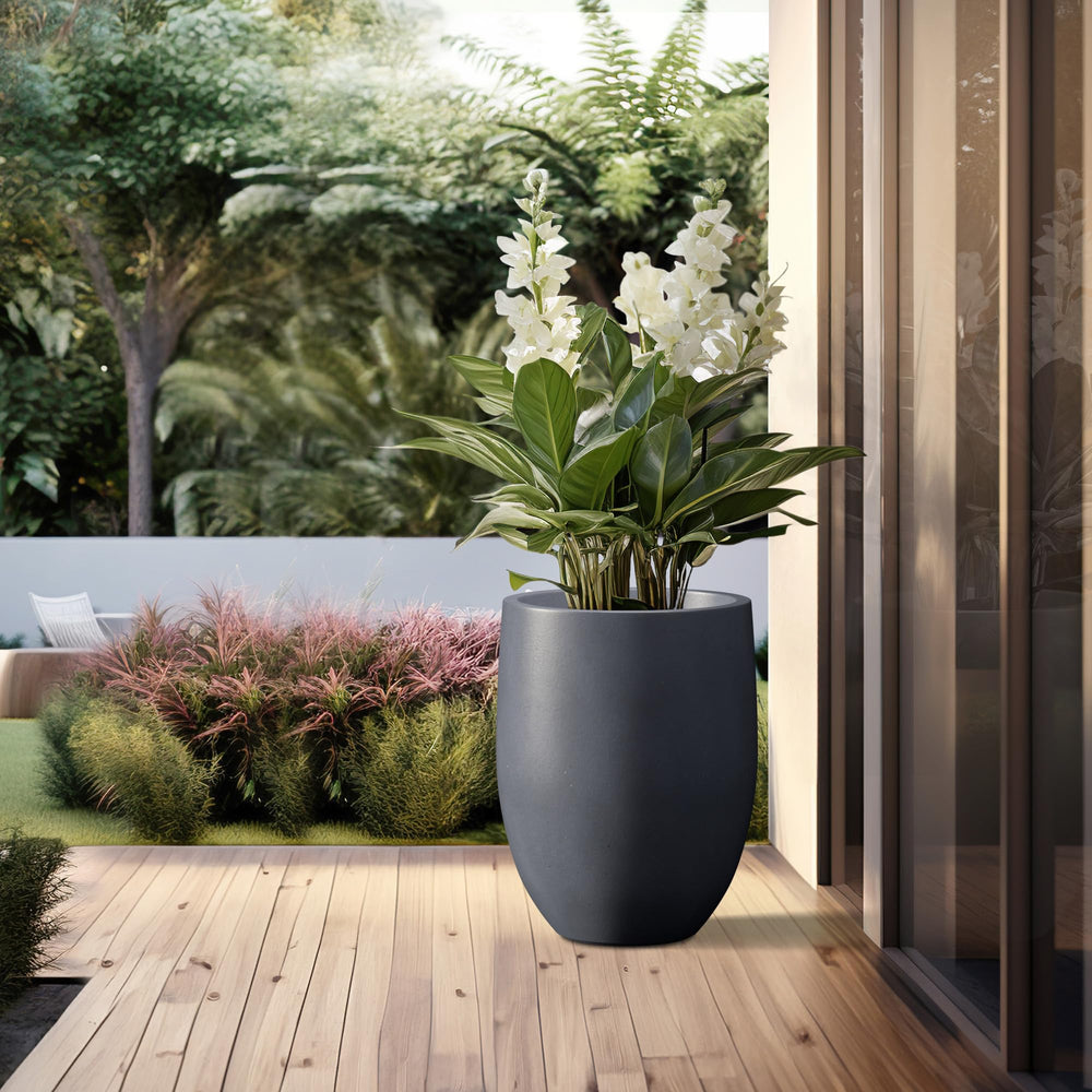kante planter in use on patio with large plant adding architectural greenery