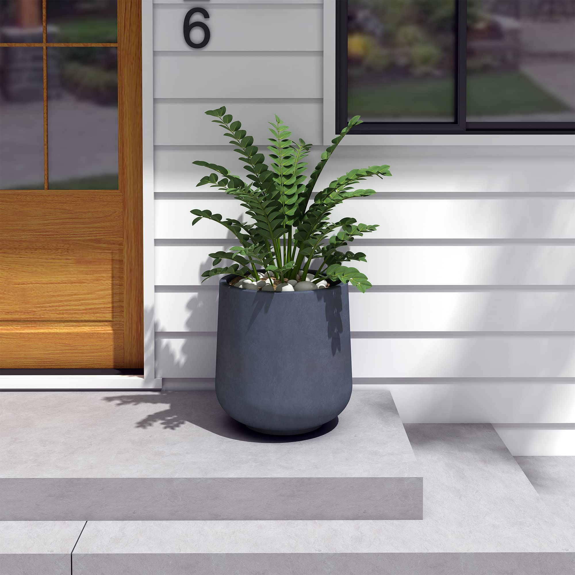 Kante planter styled in living room demonstrating indoor adaptability and elegant finish
