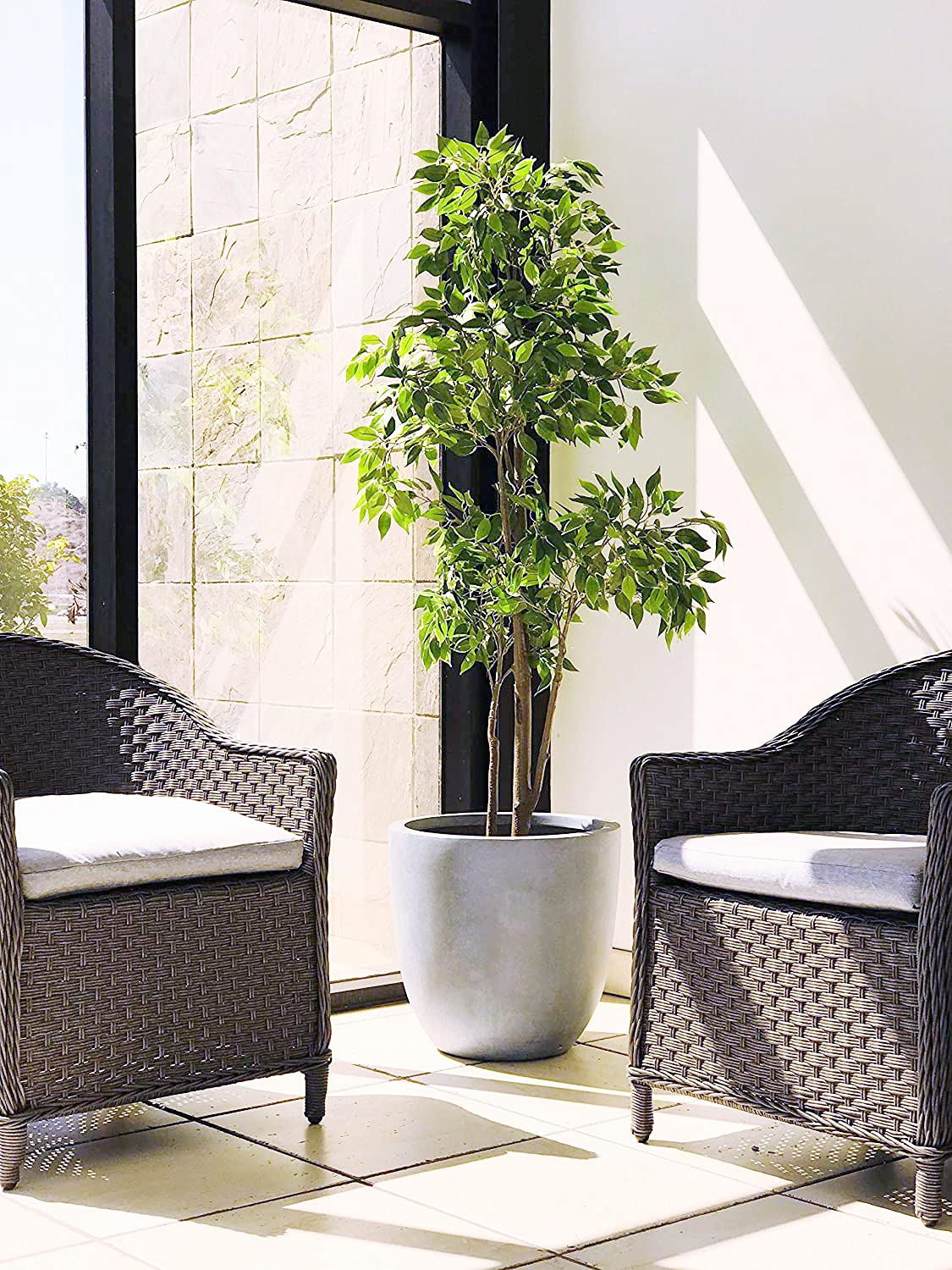 Kante planter on patio conveying durability and an all-weather outdoor benefit