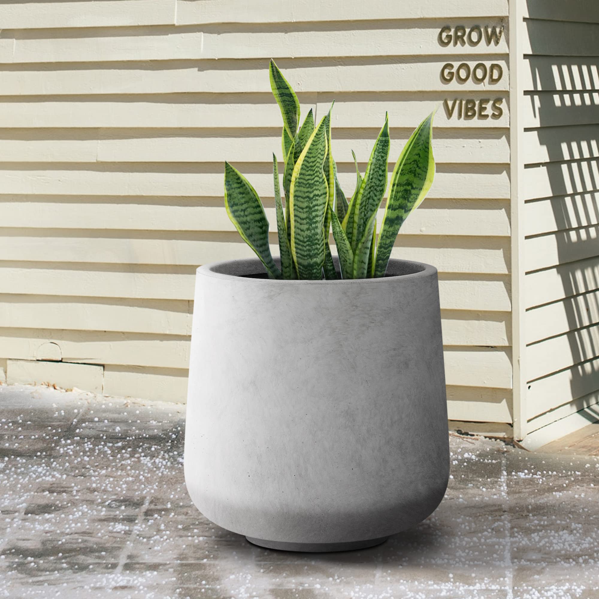 Kante planter on porch lifestyle shot showing durable weather-ready finish