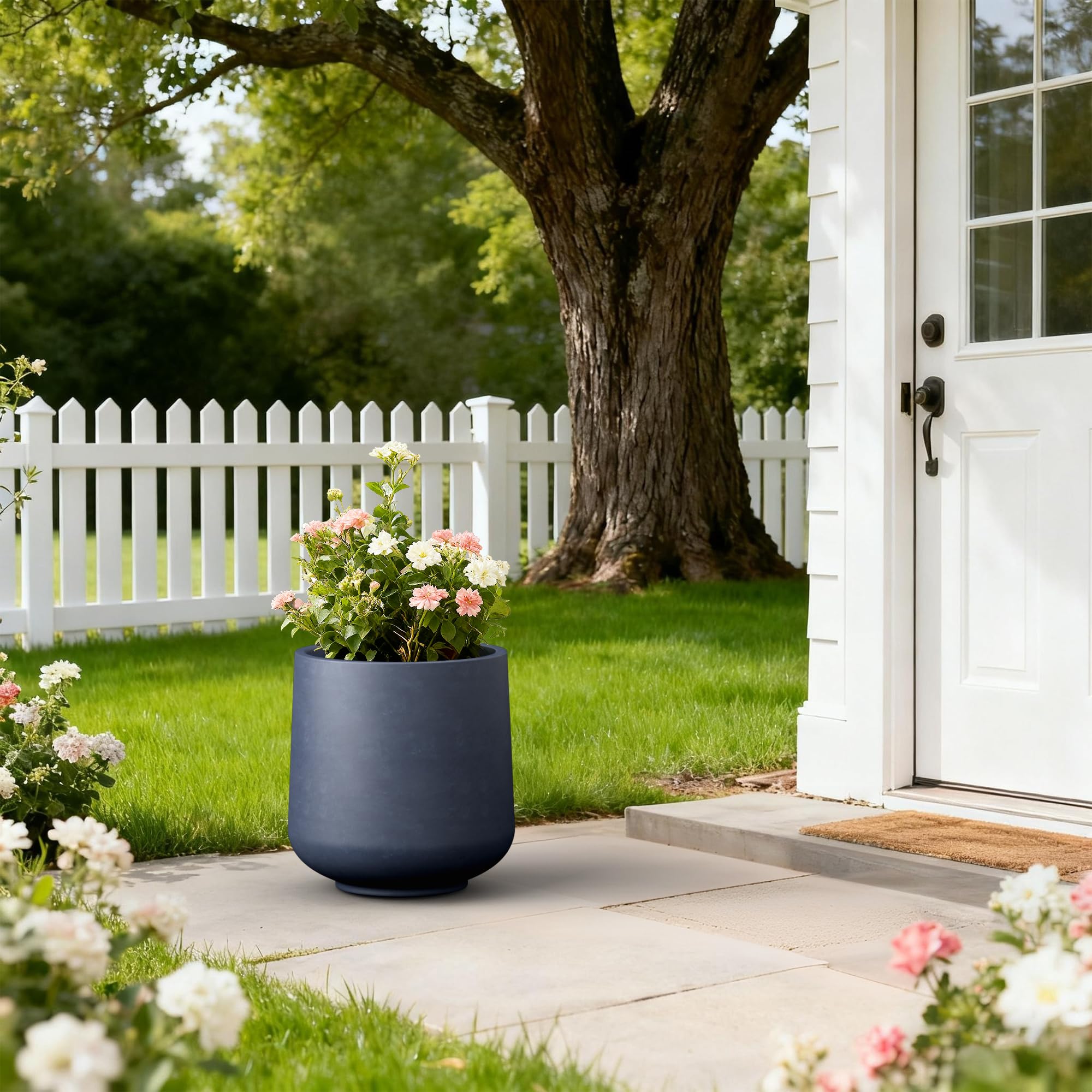 Kante planter staged on porch steps enhancing entryway with a durable focal point