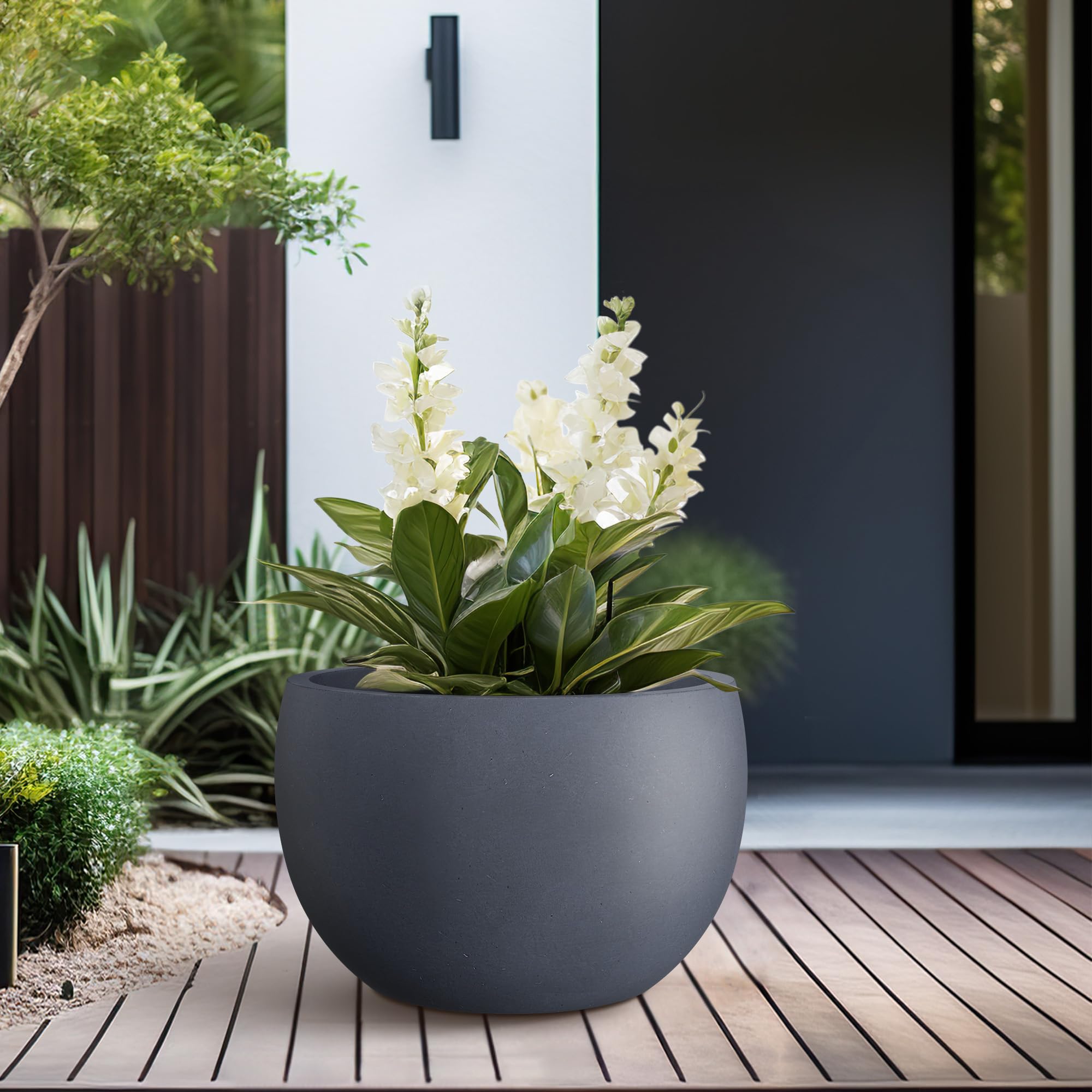 Kante planter next to a chair showing 15.7" scale and manageable weight