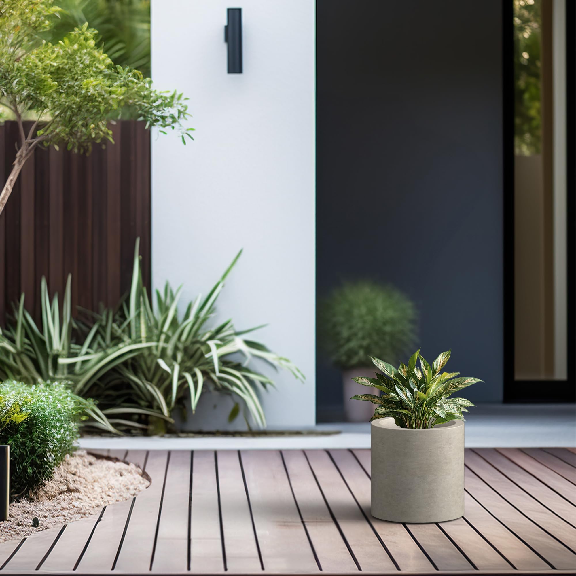 Kante planter beside hands to show lightweight composite and easy repositioning