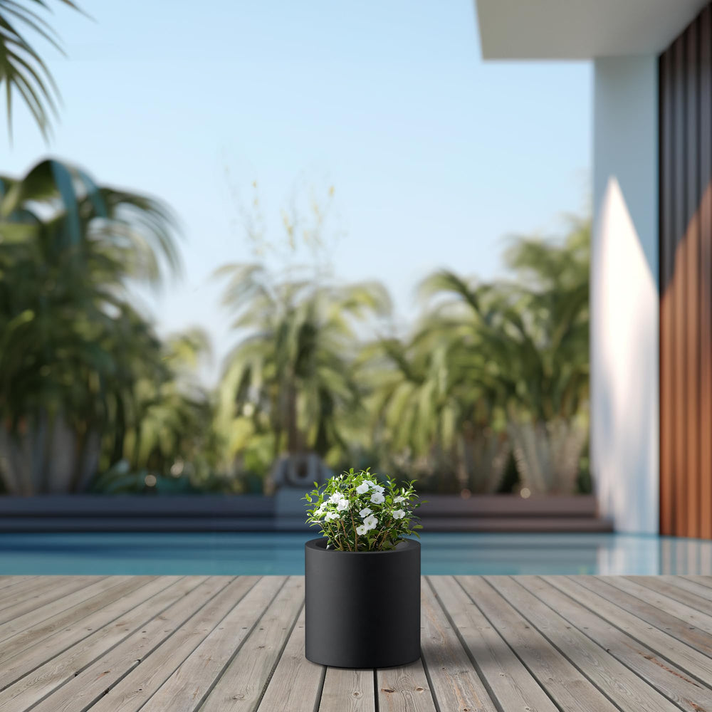 Kante planter held in hand illustrating lightweight fiberglass-concrete benefit