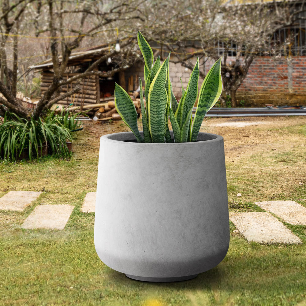 Kante planter styled with greenery showing how it enhances plant presentation