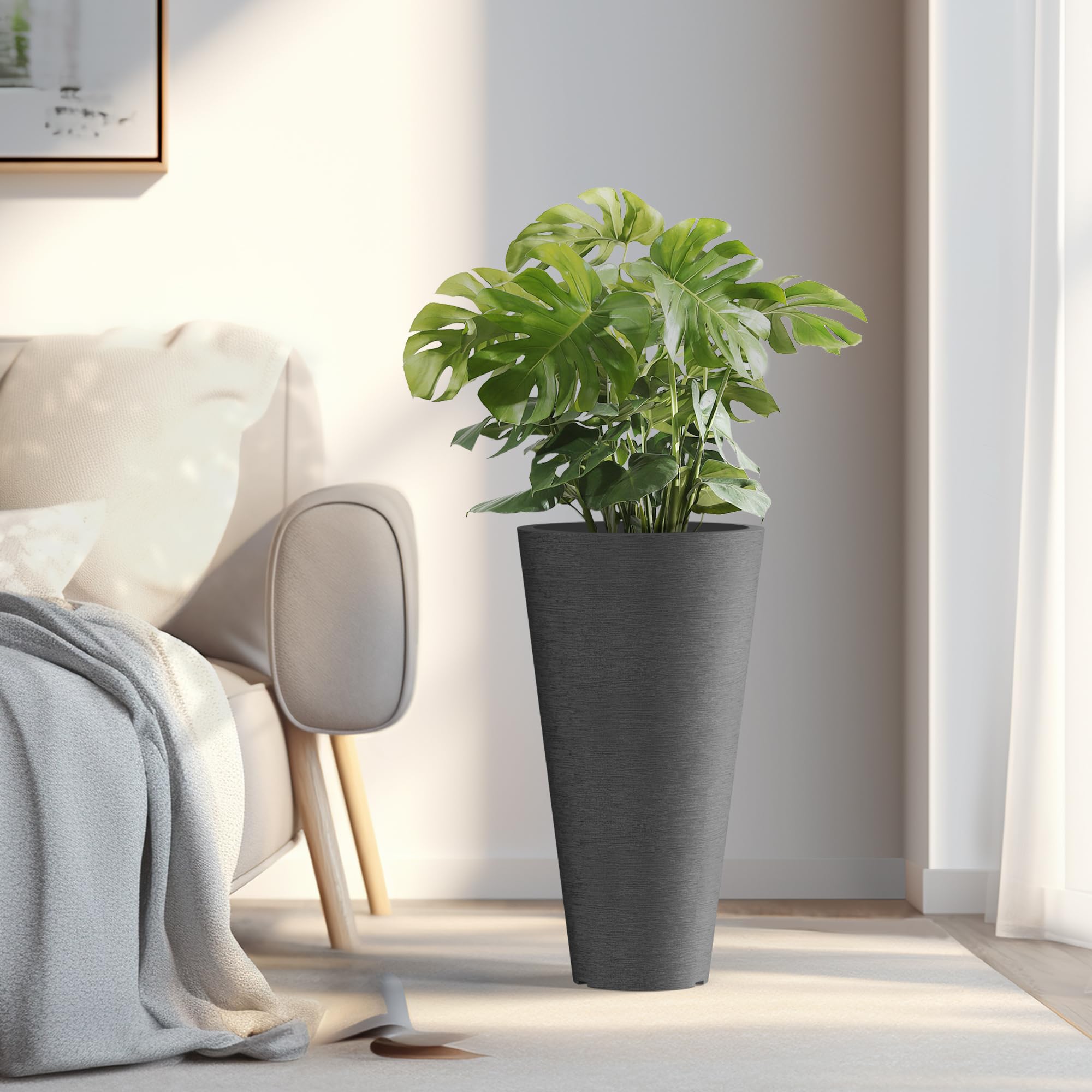 Kante planter holding a tall indoor plant to demonstrate capacity and height