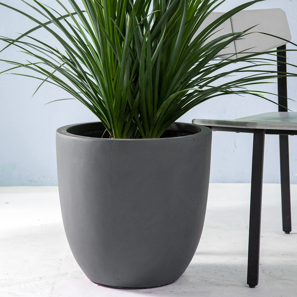 Kante next to chair for scale demonstrating ample planting space benefit