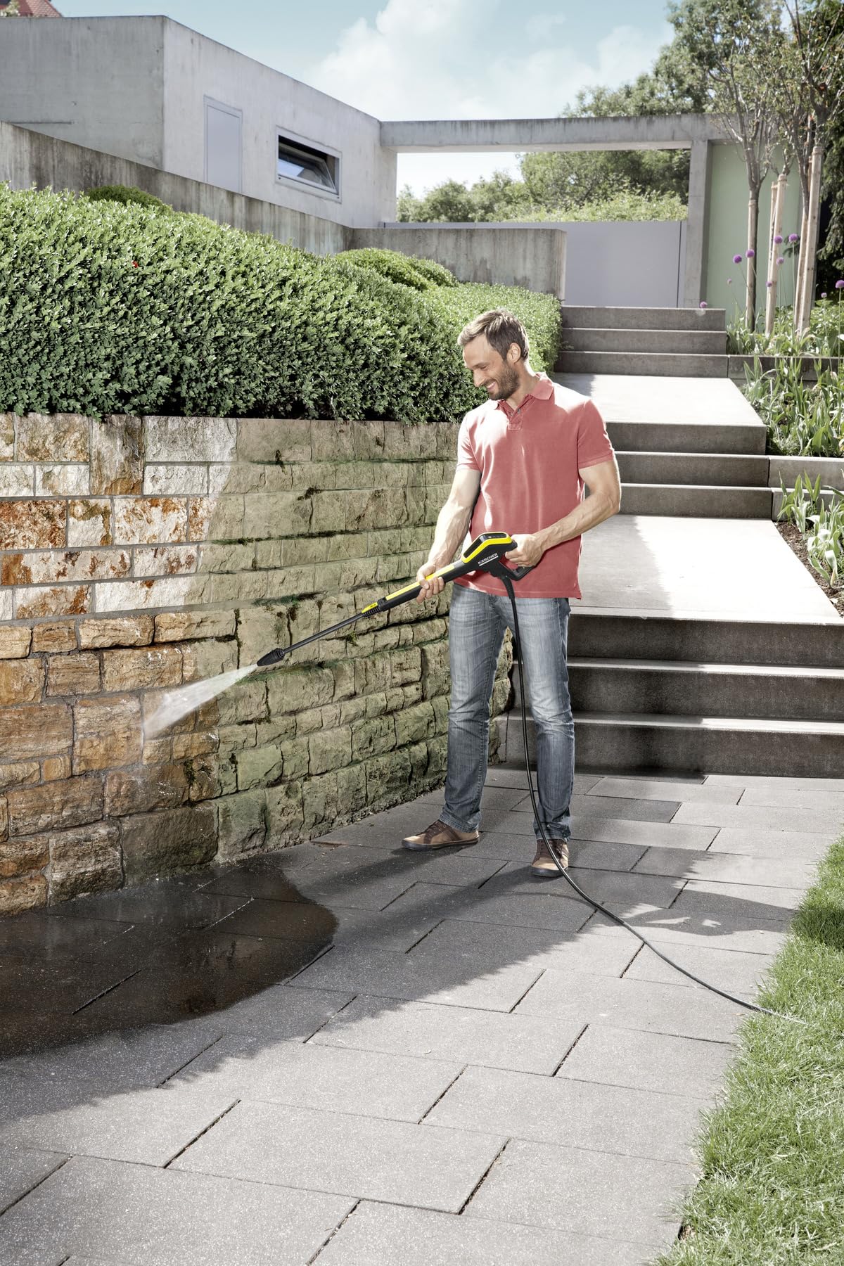 Kärcher DirtBlaster cleaning driveway showing faster grime removal benefit