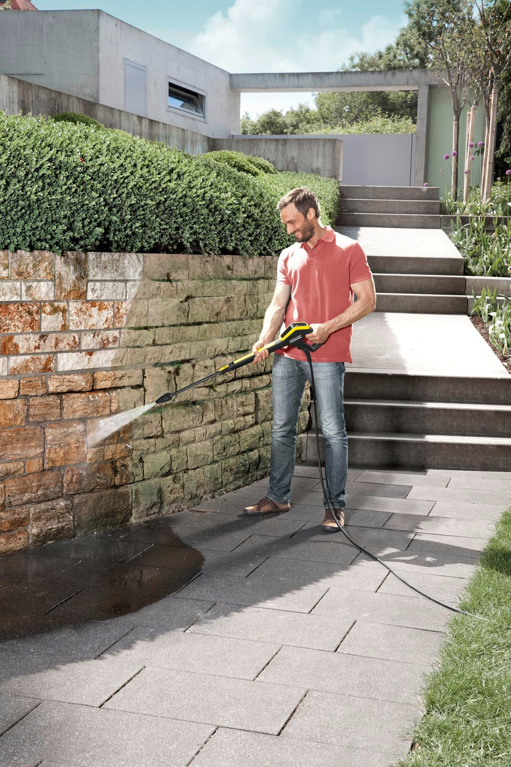 Kärcher DirtBlaster cleaning driveway showing faster grime removal benefit