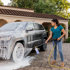 Kärcher foam cannon in use spraying thick foam onto a car for gentle cleaning