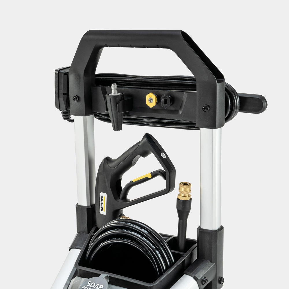 Kärcher K1700B next to a door for scale showing compact homeowner-friendly size
