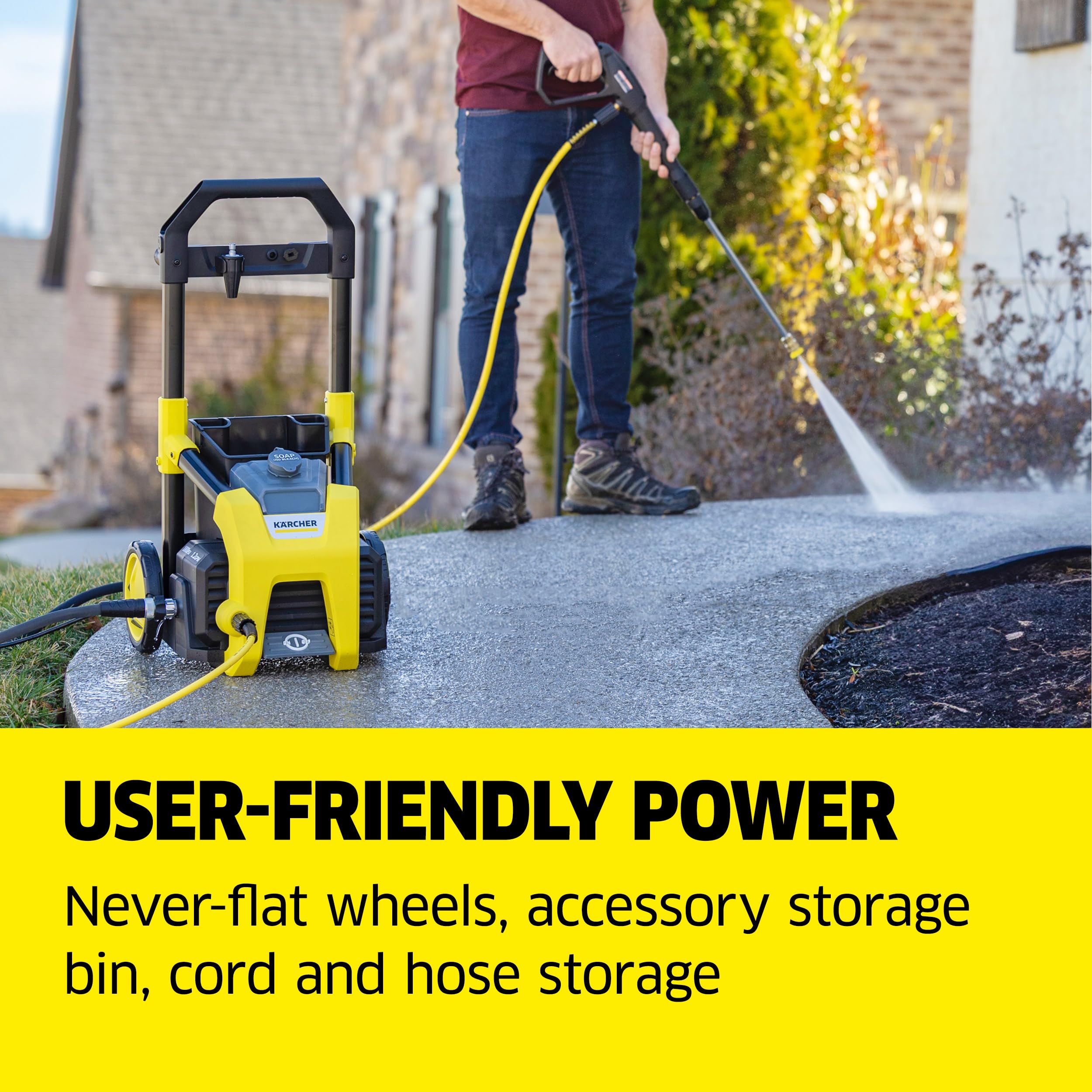 Kärcher K1800PS next to garden hose showing scale and included 20 ft M22 high‑pressure hose