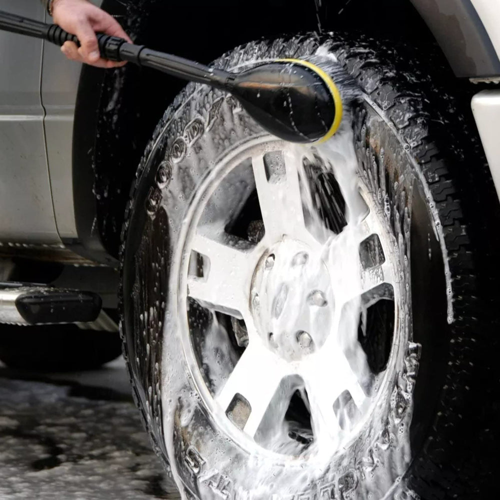 Kärcher rotating wash brush attached to wand cleaning car, saves time and reduces scrubbing