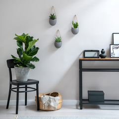Kazai Ellie size scale with hand showing compact dimensions for small spaces