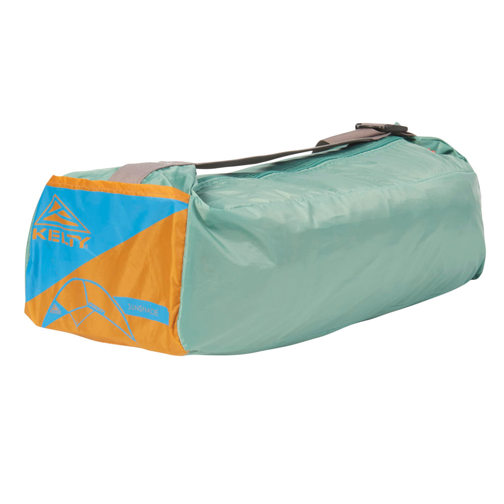 Kelty Sunshade next to a person showing scale and generous headroom benefit