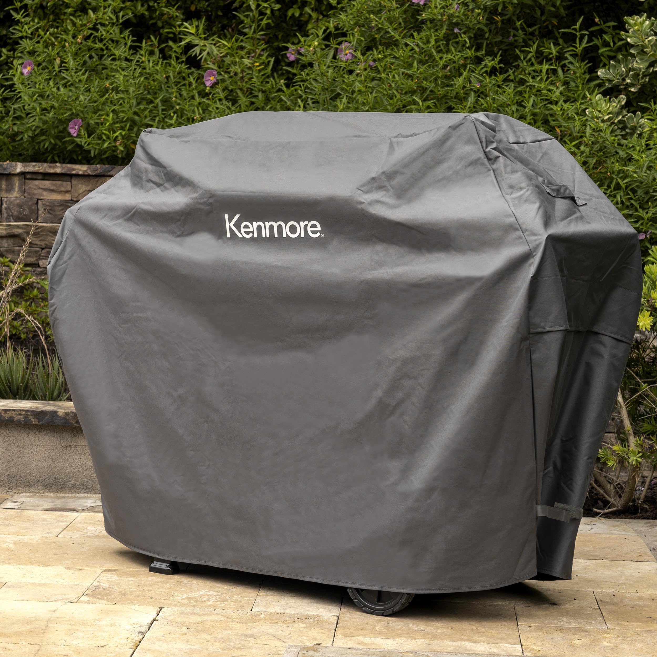 Kenmore cover beside chair showing scale and fit for 56-inch grills benefit
