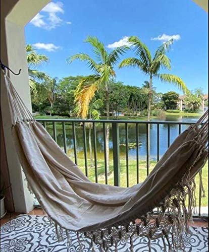 KEREITH person reading in hammock showing comfortable support and leisure use