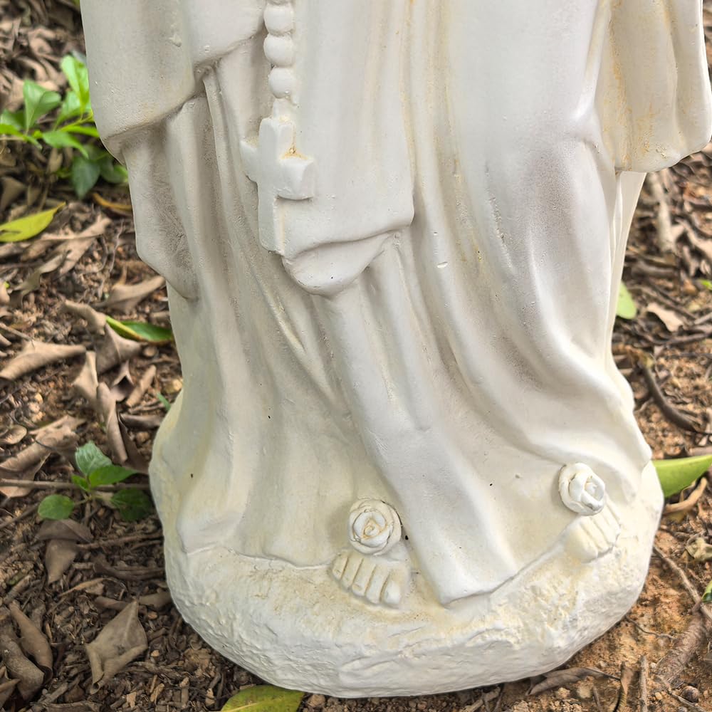 Keslecy Virgin Mary on patio offering garden focal point and sheltering peace