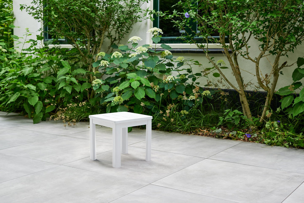 Keter side table poolside in use holding drinks and sunglasses for convenience