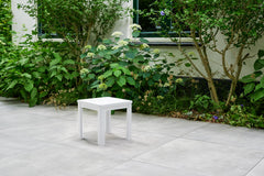 Keter side table poolside in use holding drinks and sunglasses for convenience
