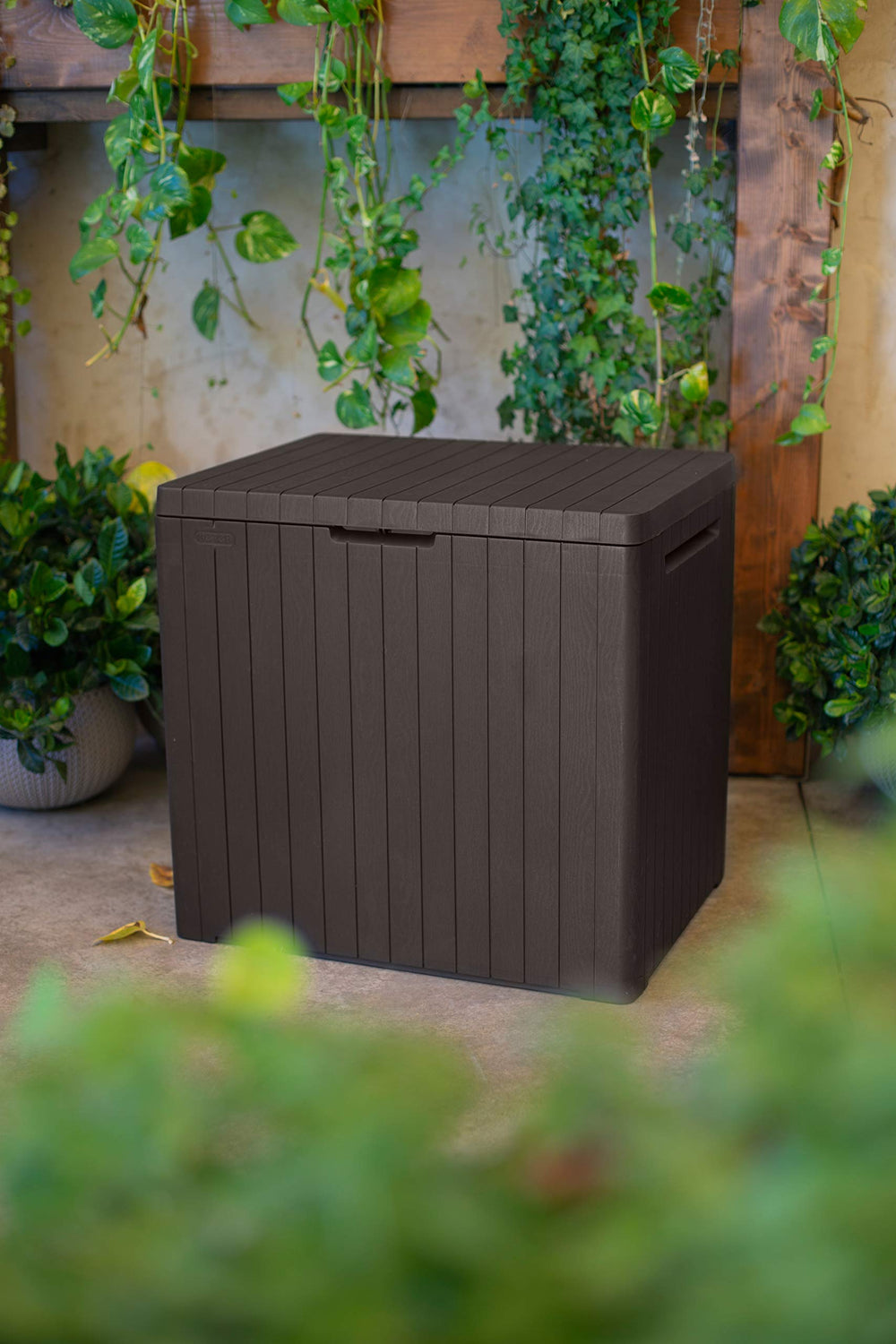 Keter City open storage inside showing 113 L capacity with cushions and tools neatly organized