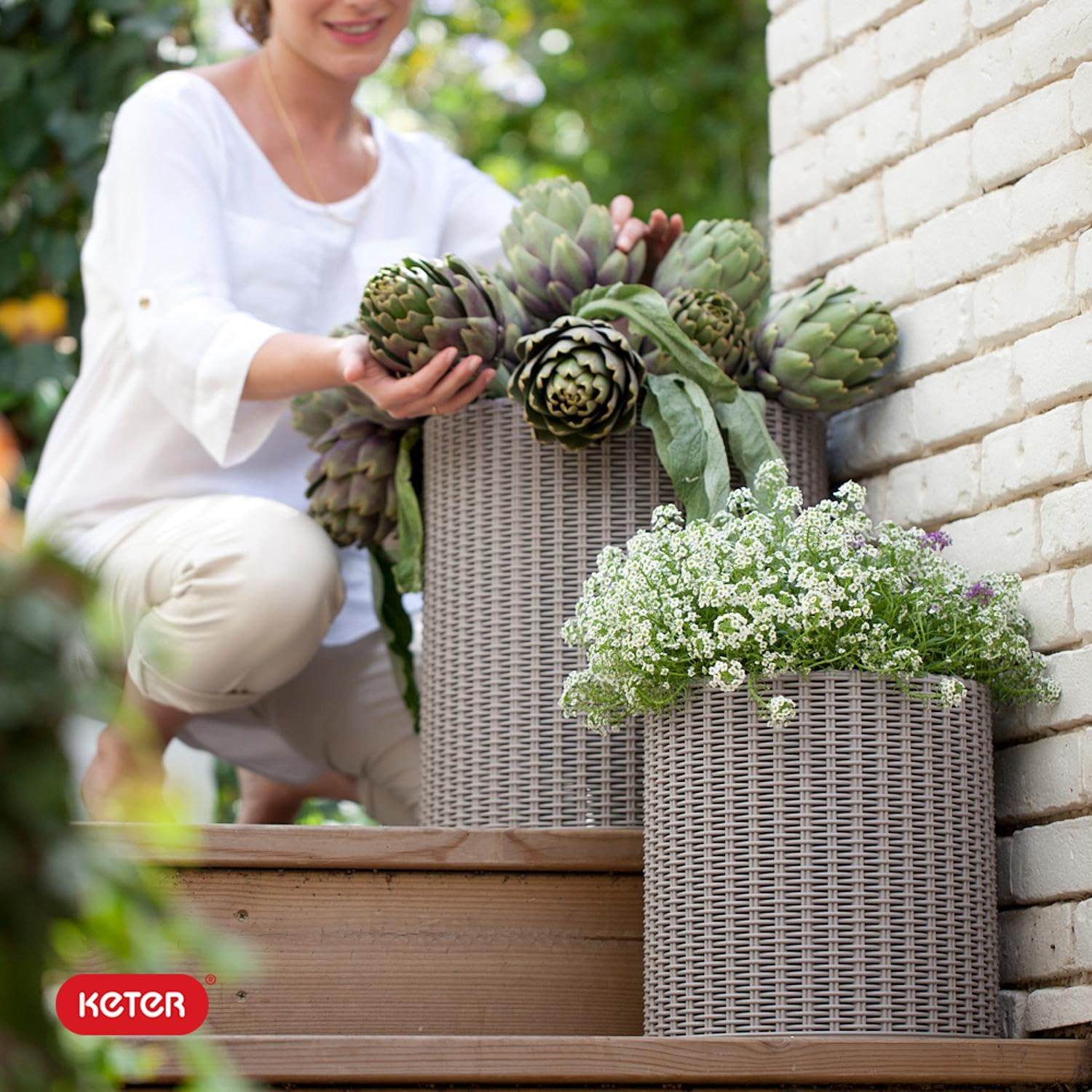 Keter lifestyle porch display with grouped planters creating layered greenery