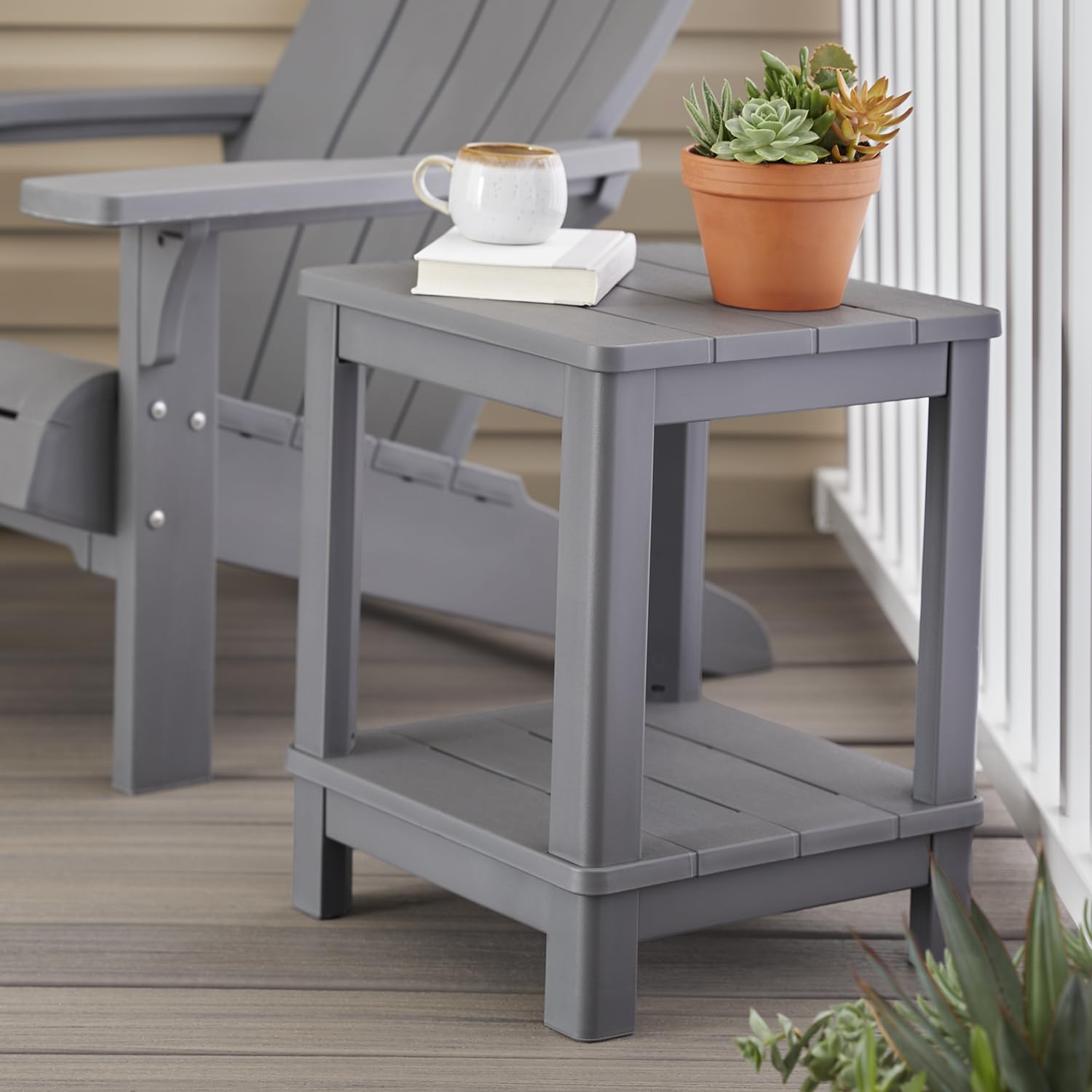 Keter side table on deck between chairs demonstrating convenient placement