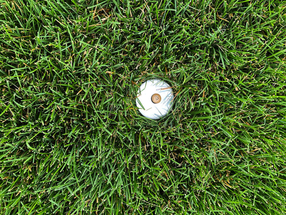 Keyfit Tools installed in lawn illustrating secure anchoring and discrete visibility benefit