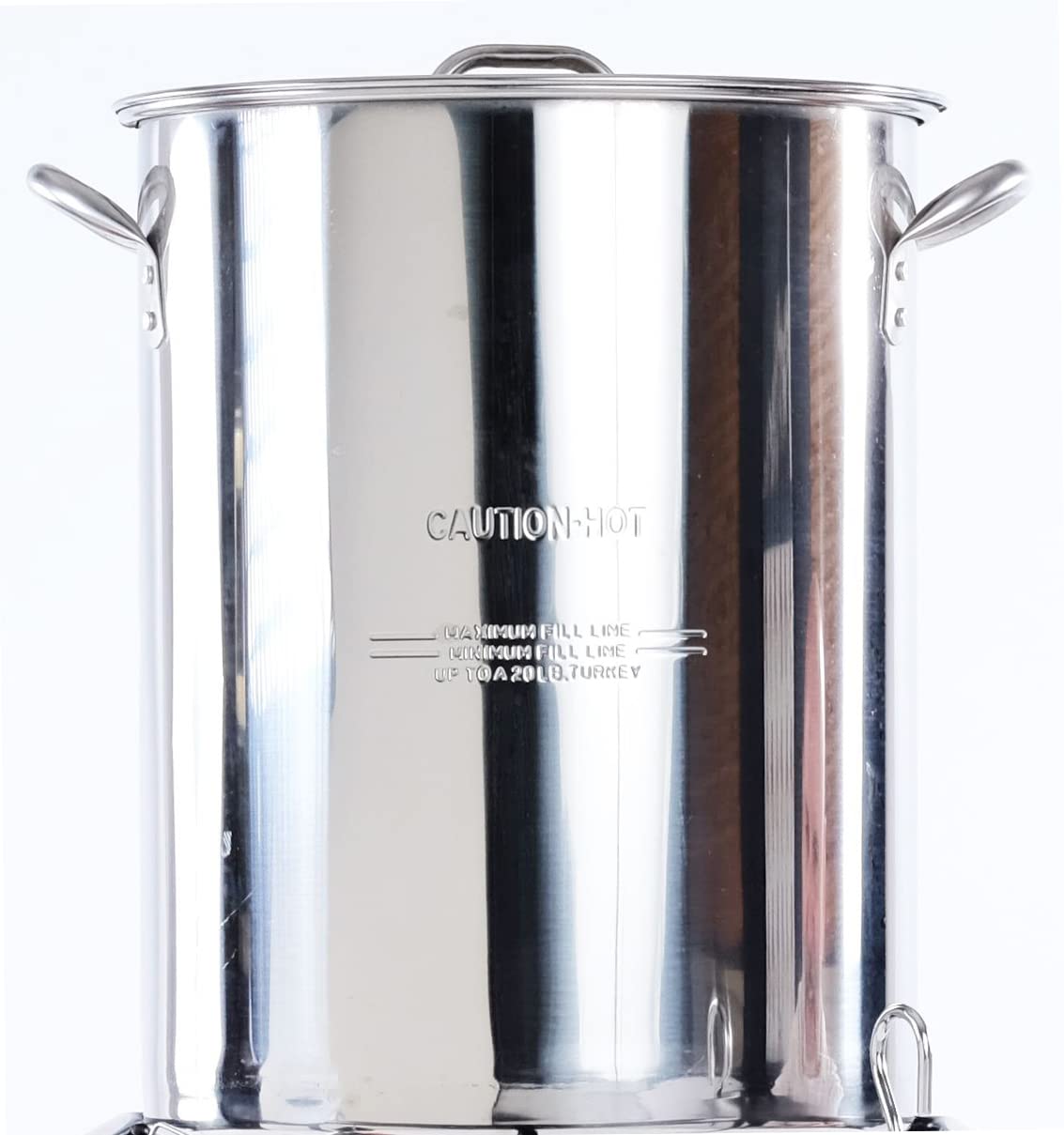 King Kooker pot in backyard use with bird being lowered, demonstrating safe operation