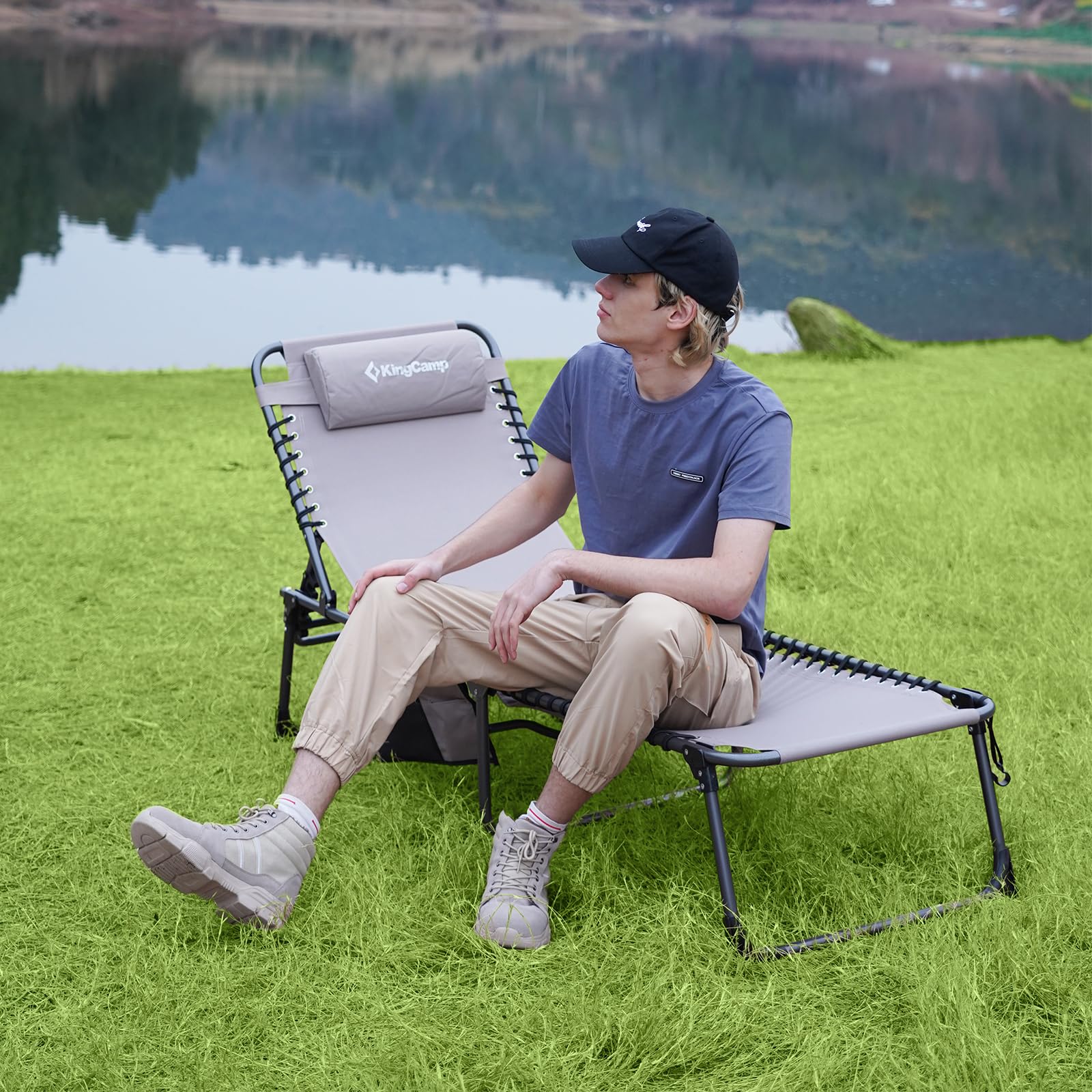 KingCamp chair with person for size comparison demonstrating portability