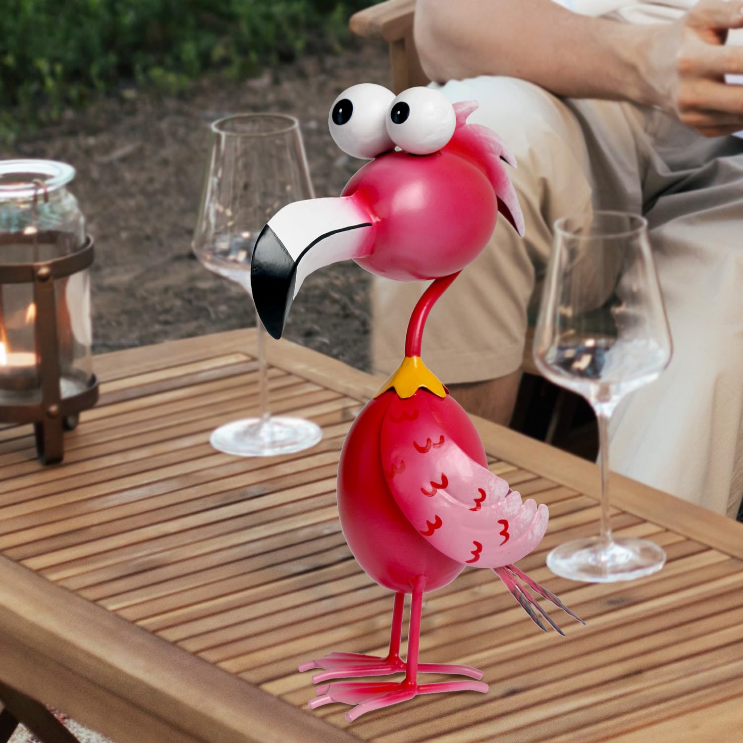 Kircust flamingo next to pot to show size and easy placement benefit