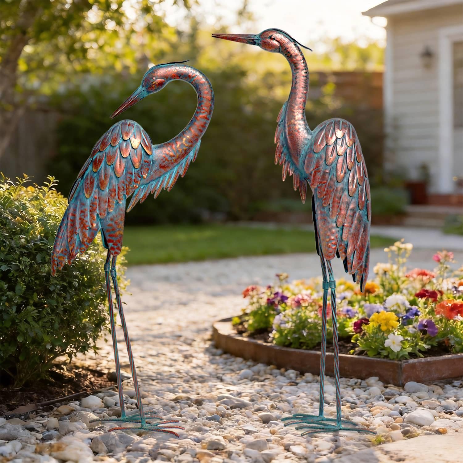 Kircust front view pair of herons showing elegant garden focal point