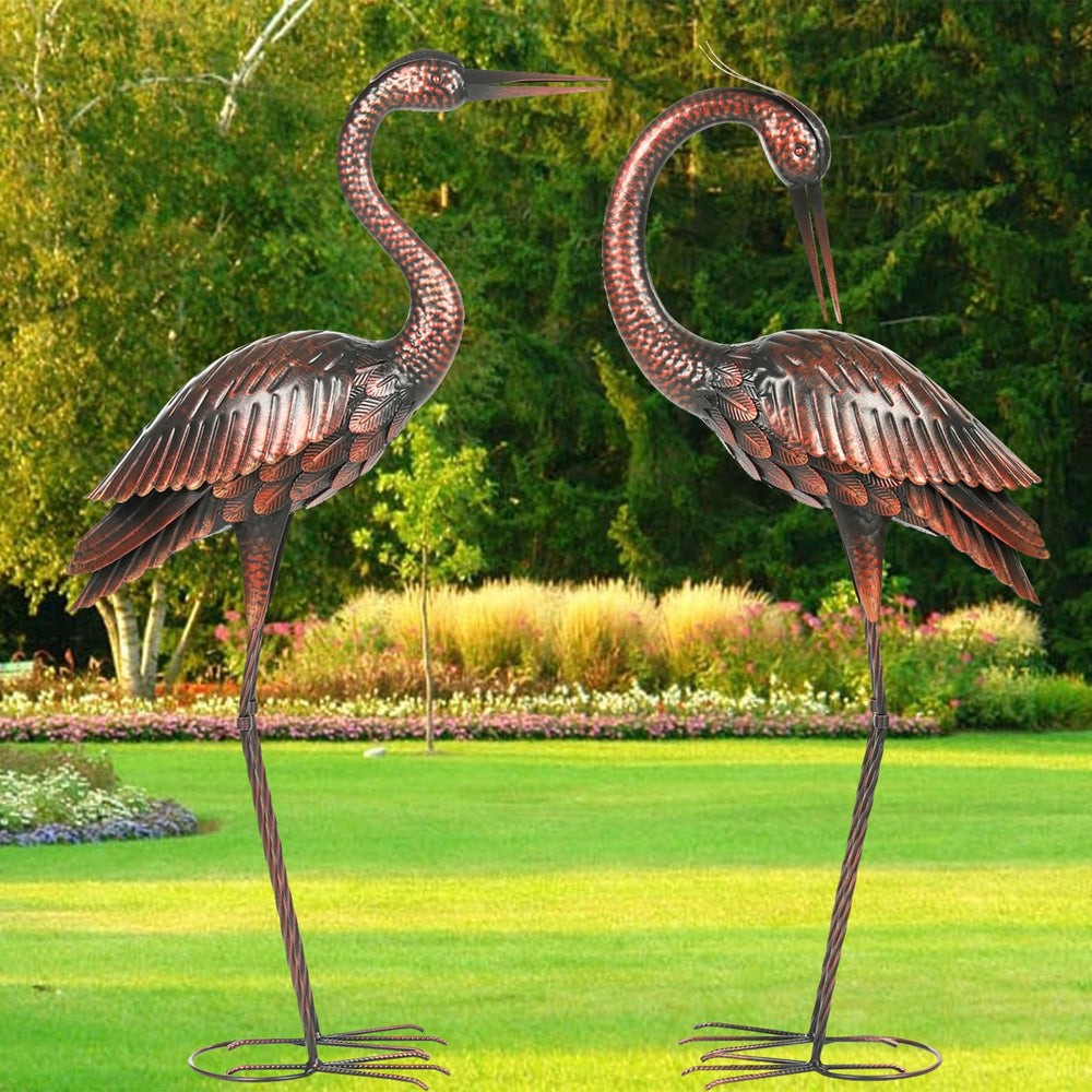 Kircust heron pair by pond illustrating decorative waterside placement