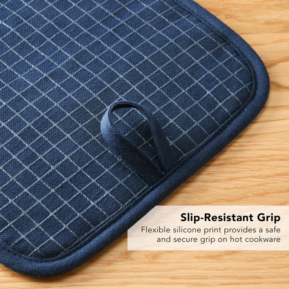 KitchenAid pot holders styled on counter matching kitchen linens for cohesion