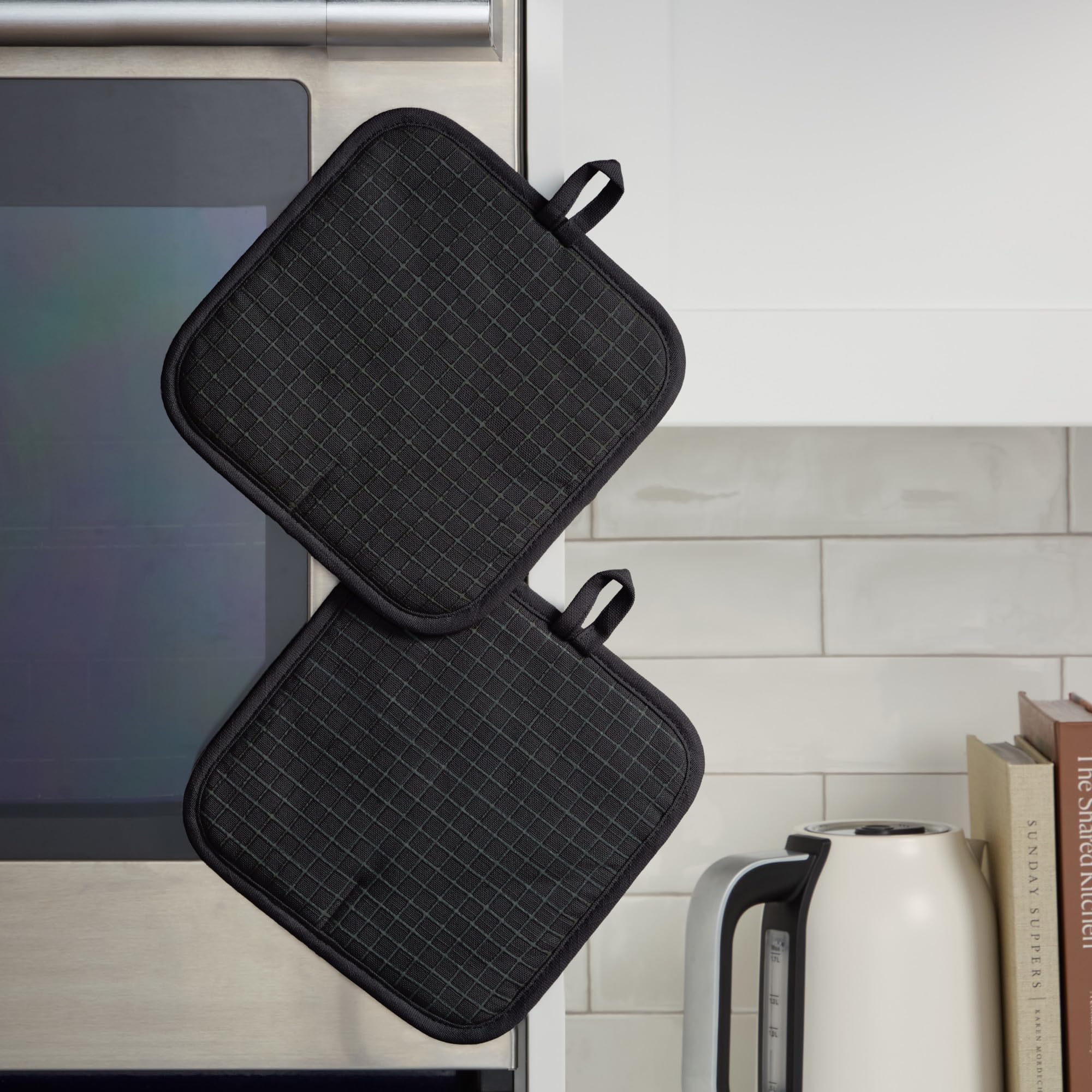 KitchenAid pot holder gripping a hot baking sheet to prevent slips