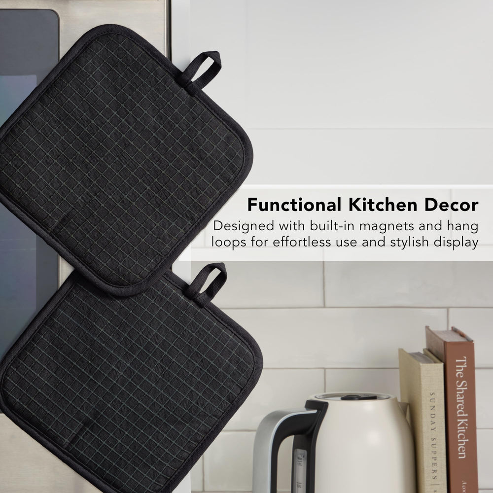 KitchenAid next to a wooden spoon showing compact 8x8 size convenience