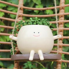 KIUGCO front view glossy smiley face planter showing cheerful decor benefit